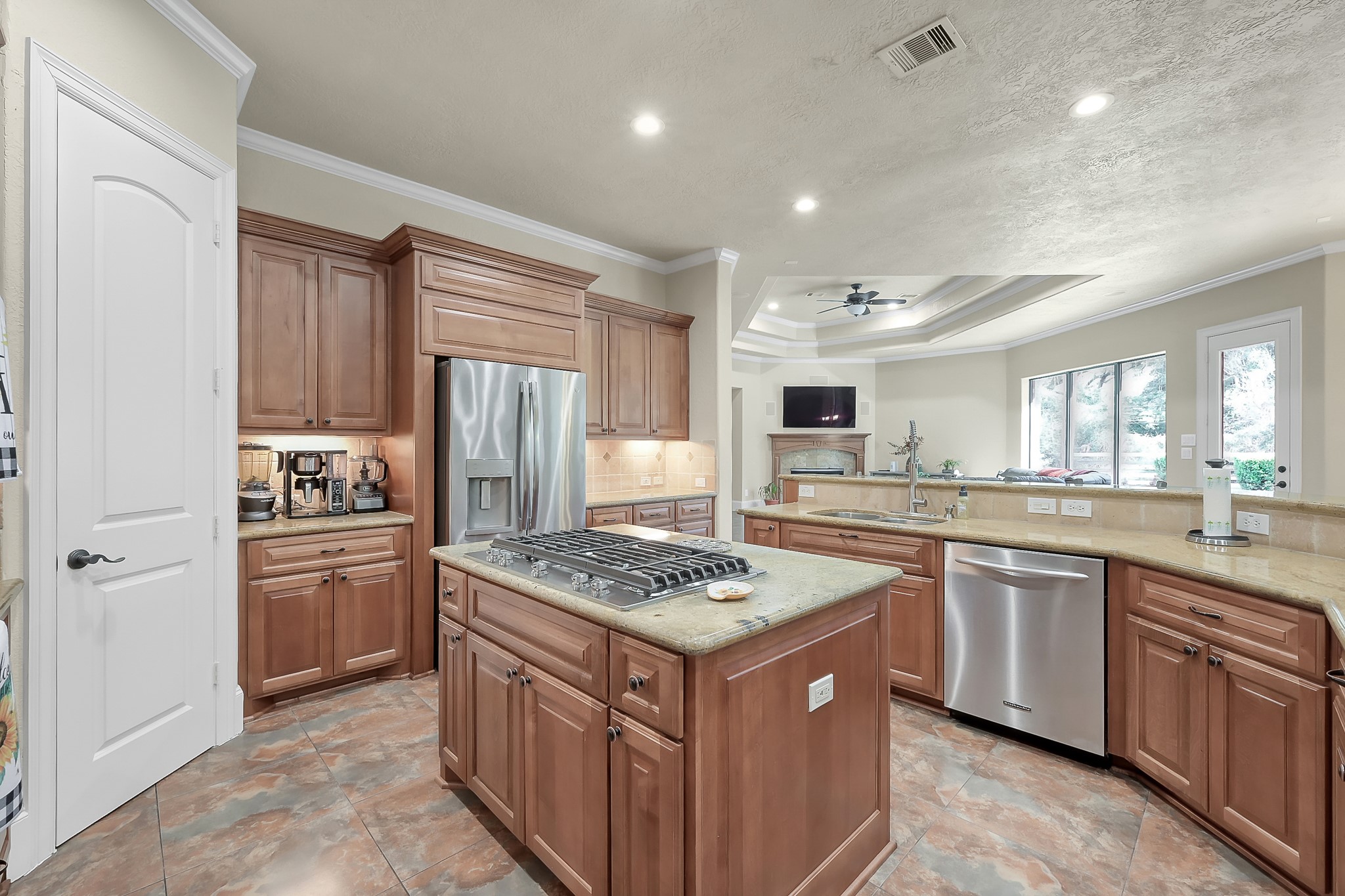 22742 Timberlake Creek Road Tomball, TX 77377 - Photo 21 of 50 a kitchen that has a lot of cabinets in it and stainless steel appliances