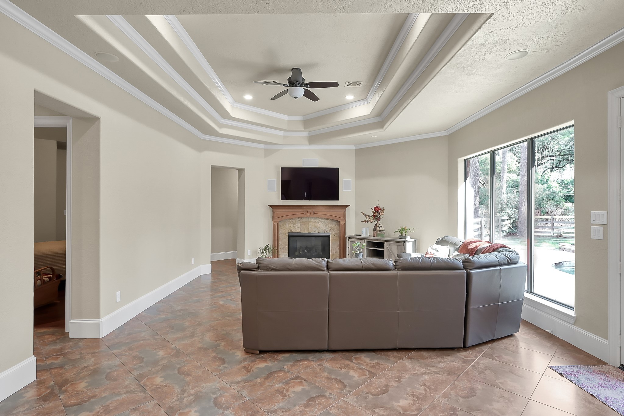 22742 Timberlake Creek Road Tomball, TX 77377 - Photo 23 of 50 a living room with a couch and a flat screen tv