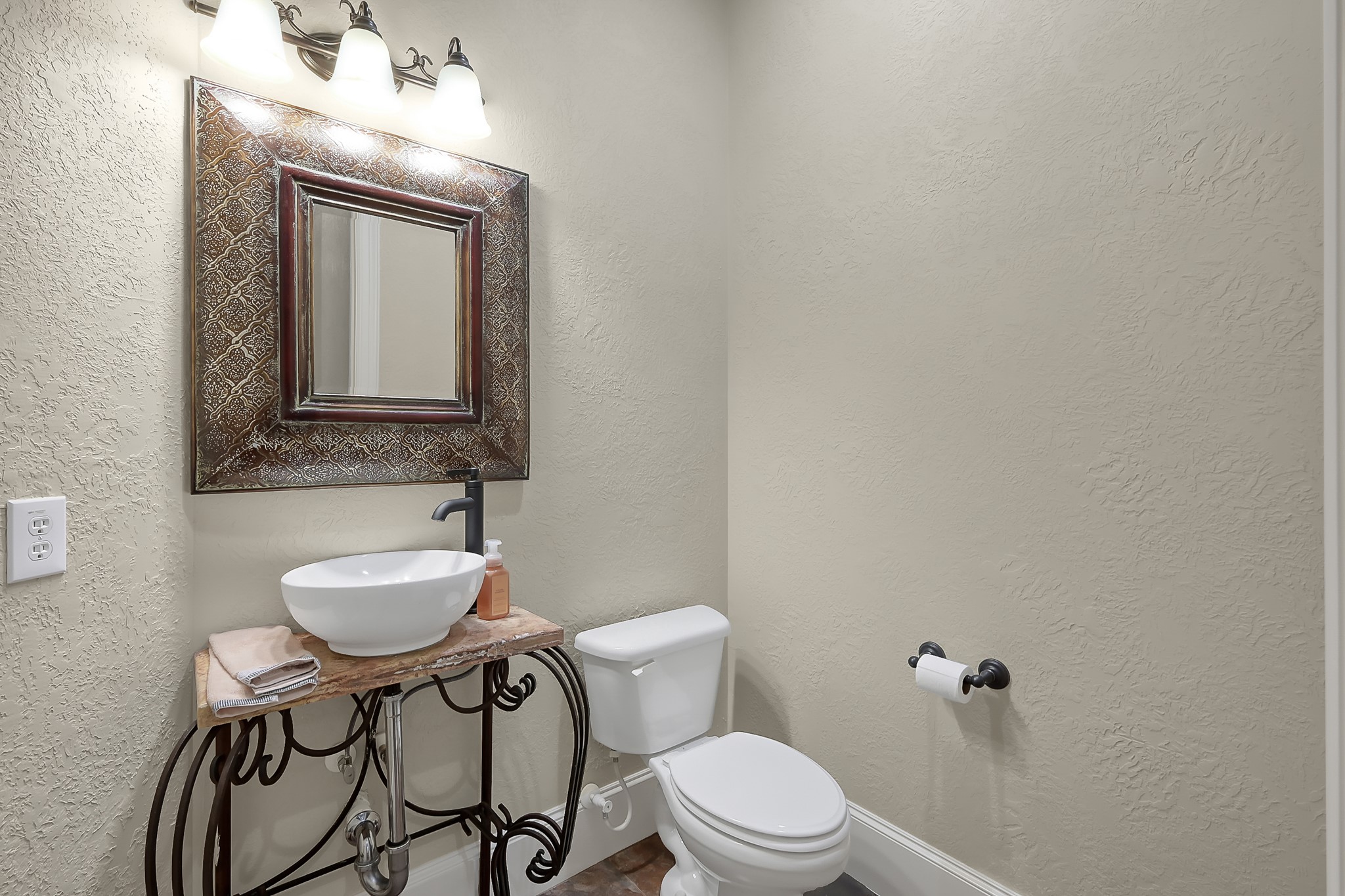 22742 Timberlake Creek Road Tomball, TX 77377 - Photo 31 of 50 a bathroom with a toilet a sink and mirror