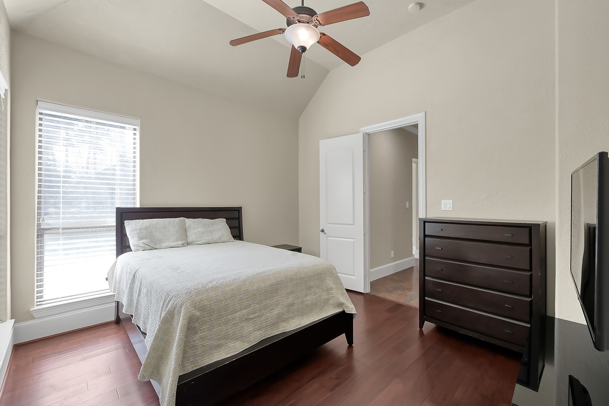 22742 Timberlake Creek Road Tomball, TX 77377 - Photo 33 of 50 a bedroom with a bed and a ceiling fan