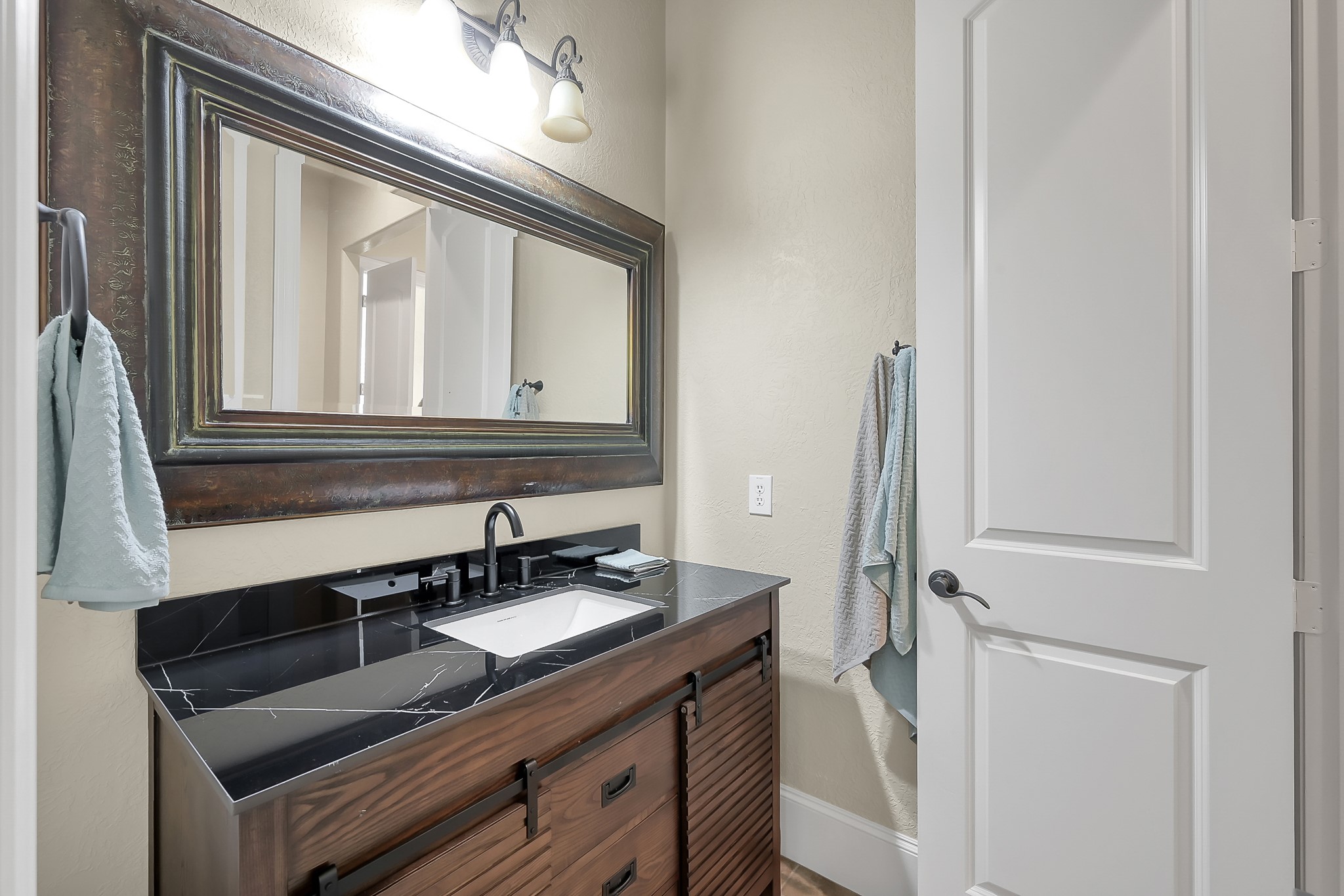 22742 Timberlake Creek Road Tomball, TX 77377 - Photo 34 of 50 a bathroom with a sink and a mirror