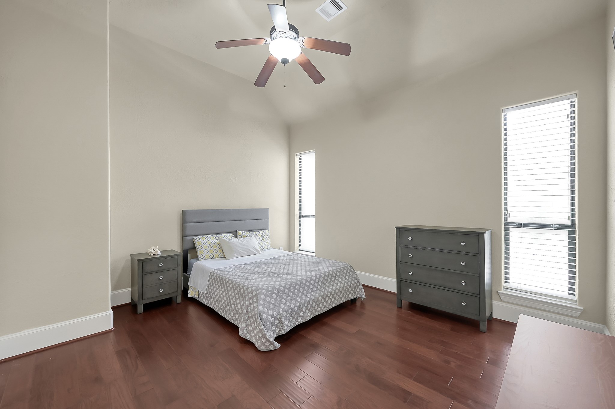 22742 Timberlake Creek Road Tomball, TX 77377 - Photo 35 of 50 a bedroom with a bed and a chandelier