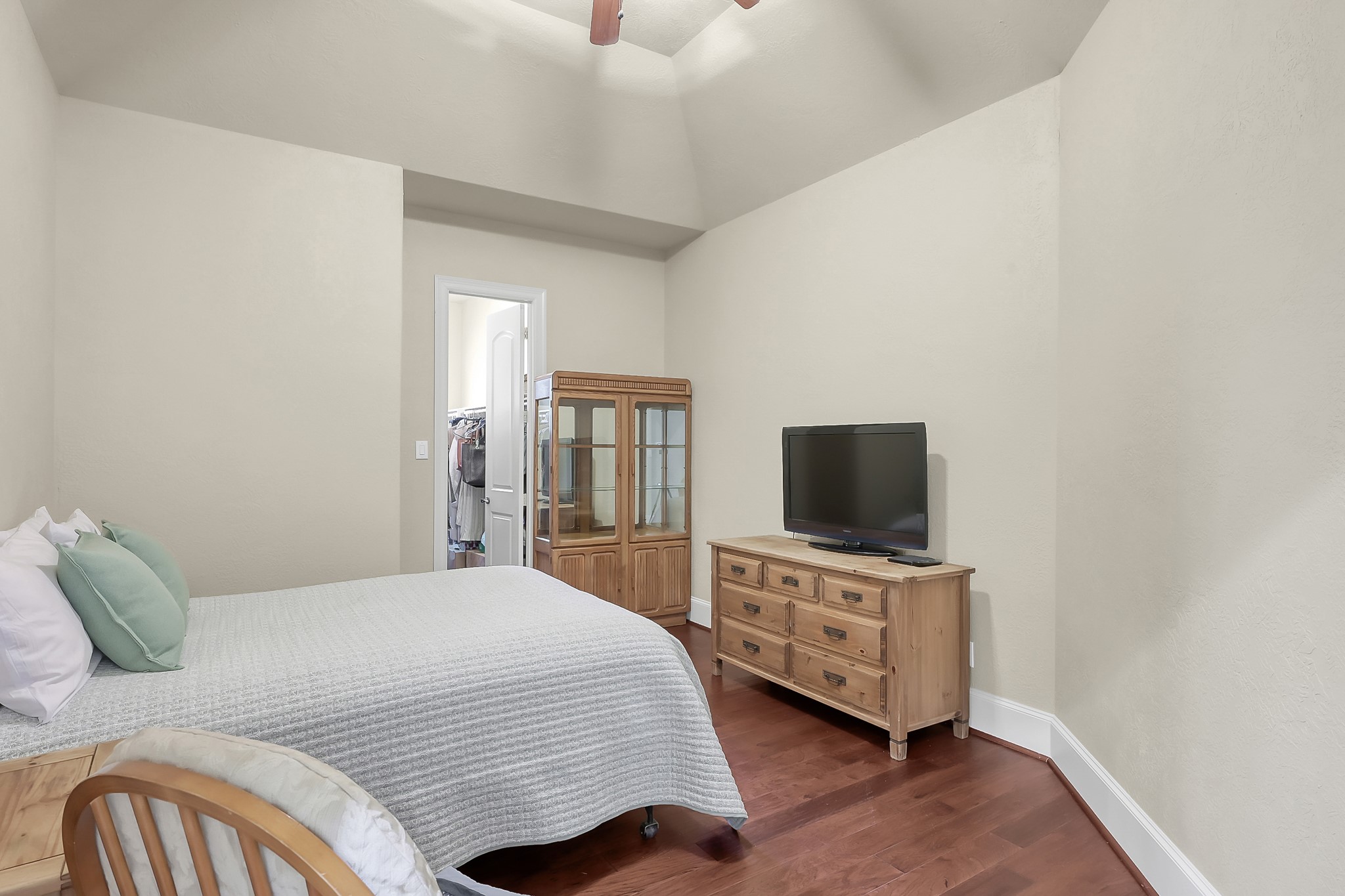 22742 Timberlake Creek Road Tomball, TX 77377 - Photo 38 of 50 a bedroom with a bed and a flat tv screen on wall