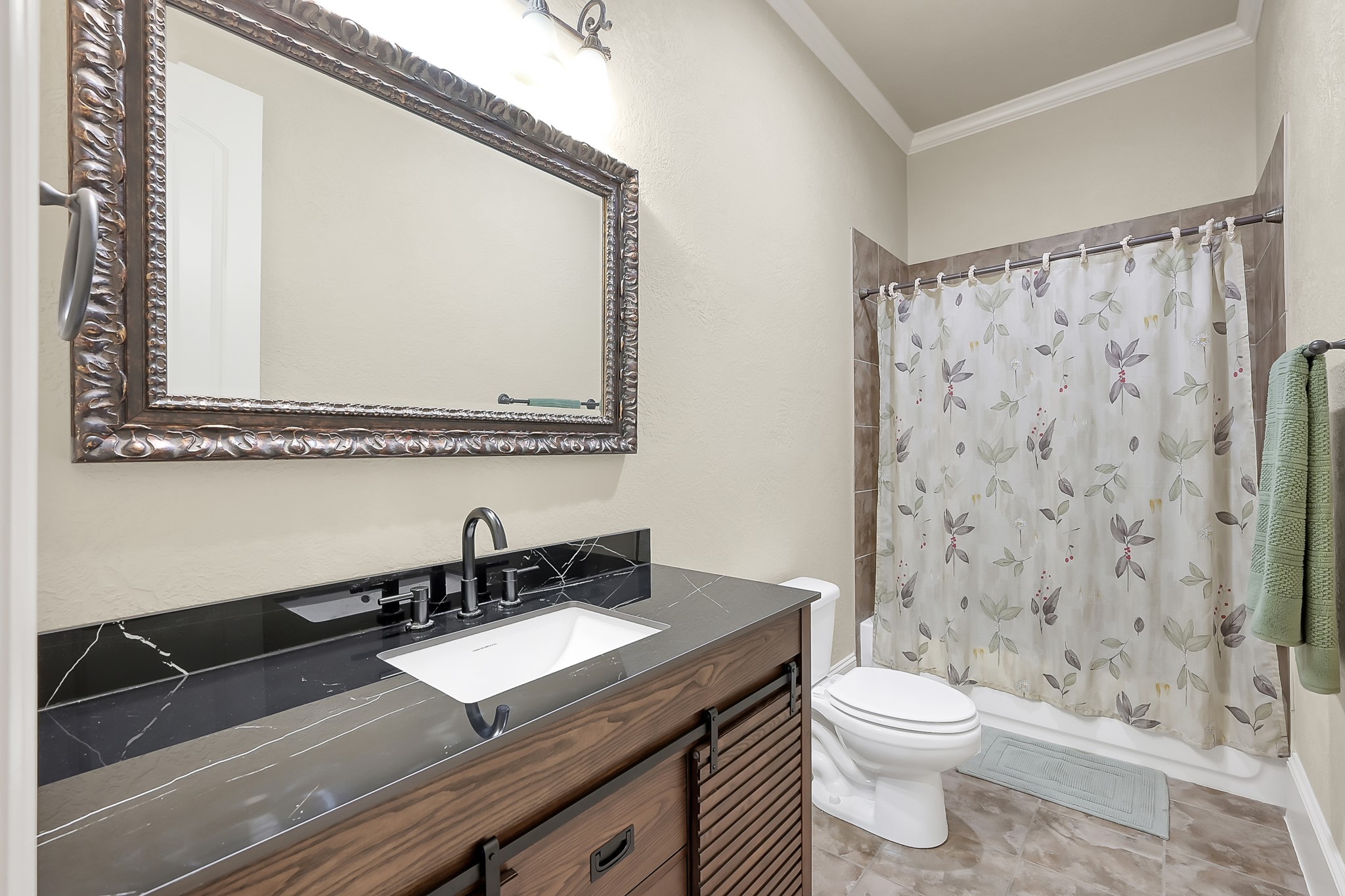 22742 Timberlake Creek Road Tomball, TX 77377 - Photo 40 of 50 a bathroom with a granite countertop sink a toilet and a mirror