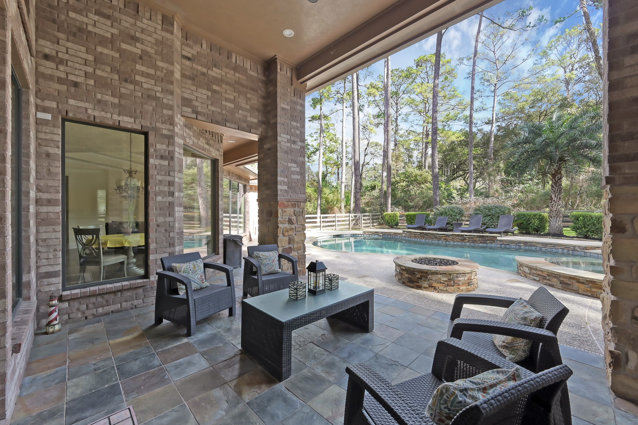 22742 Timberlake Creek Road Tomball, TX 77377 - Photo 42 of 50 a living room with furniture and a floor to ceiling window