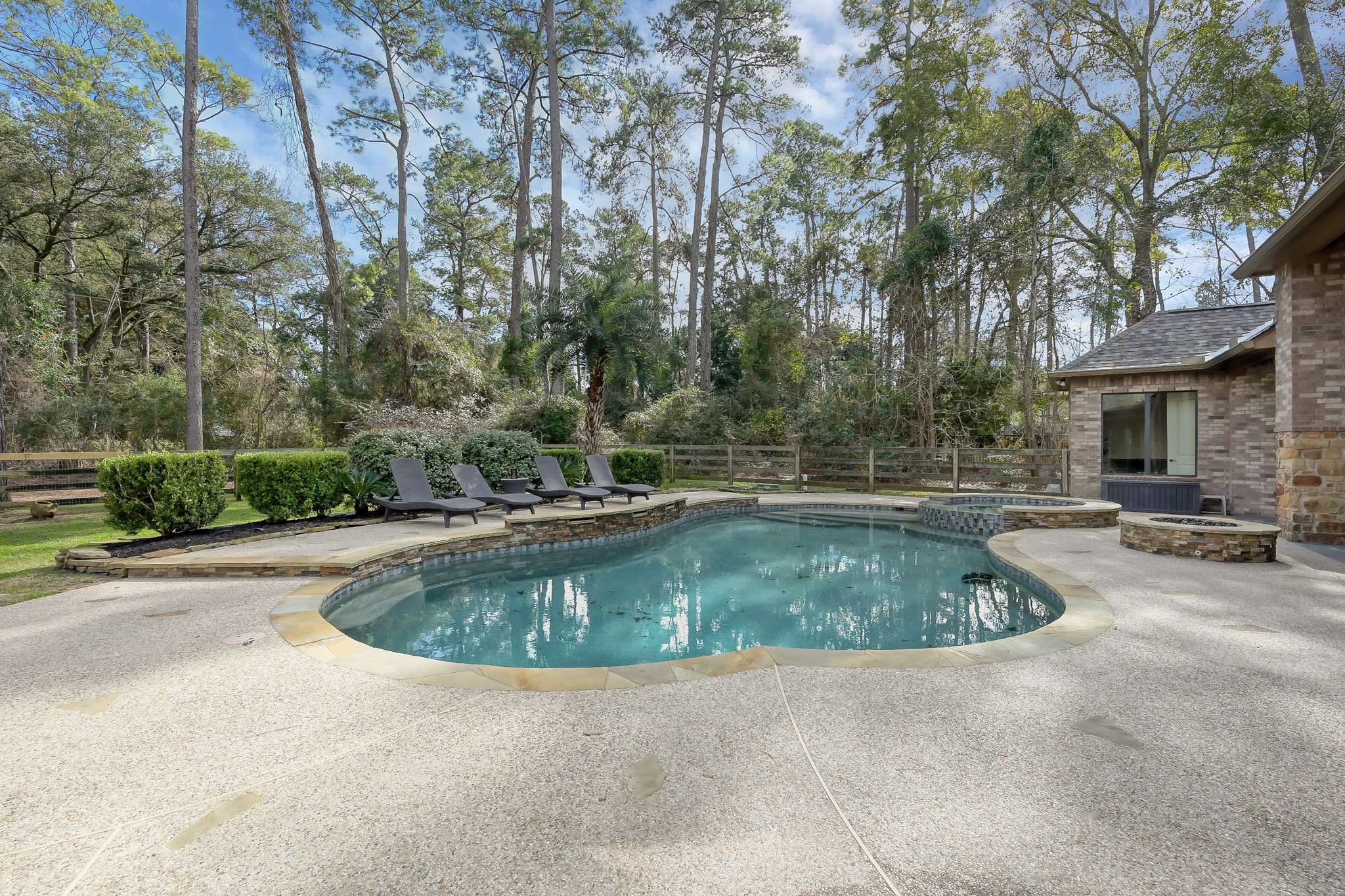 22742 Timberlake Creek Road Tomball, TX 77377 - Photo 44 of 50 a view of a swimming pool with a sitting area