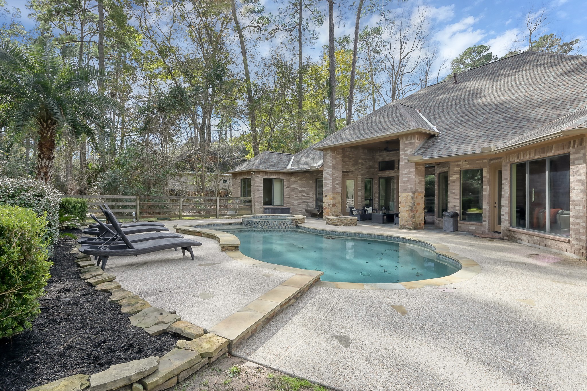 22742 Timberlake Creek Road Tomball, TX 77377 - Photo 45 of 50 a view of a house with pool and chairs