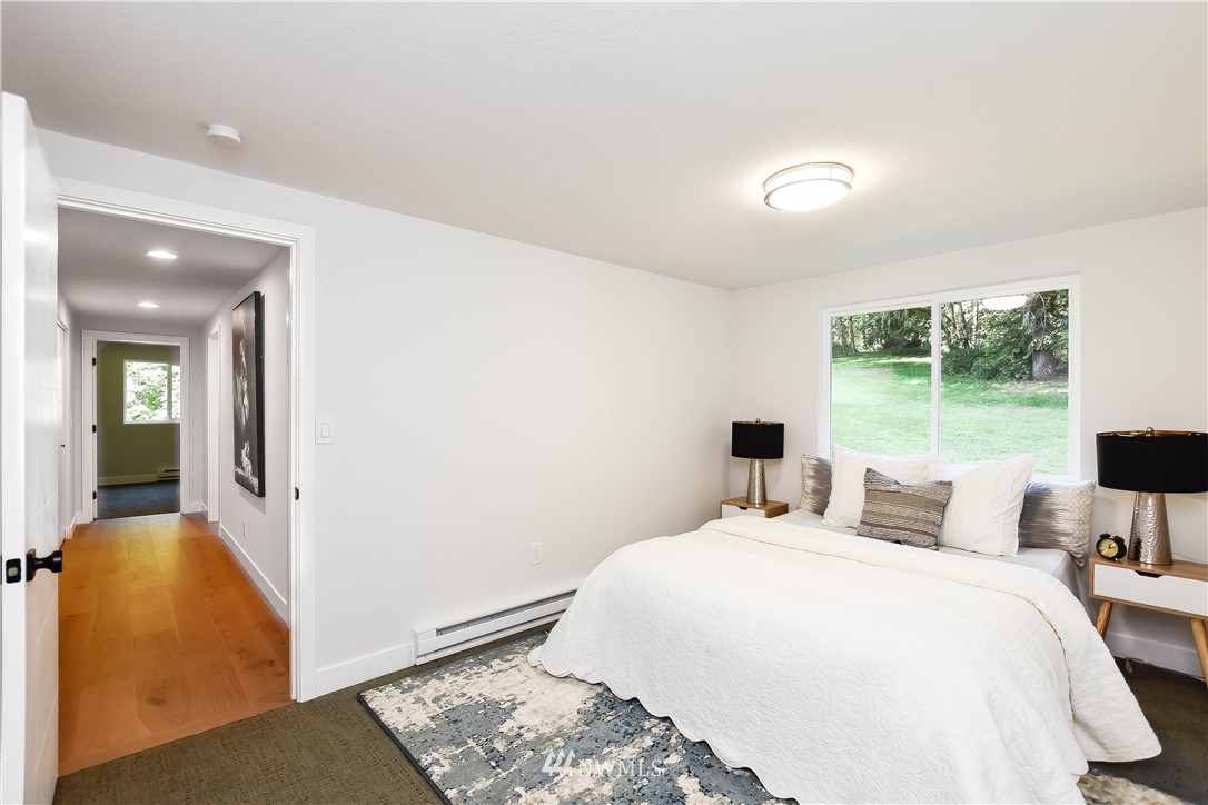 19409 High Rock Road Monroe, WA 98272 - Photo 27 of 40 a bedroom with a bed and a window