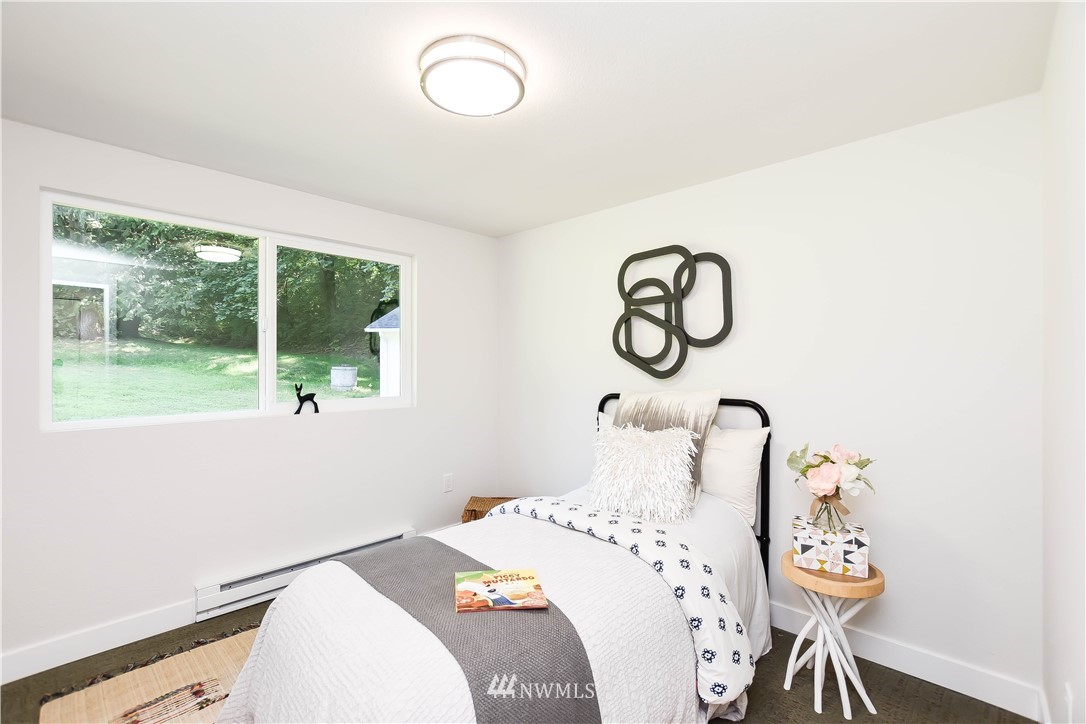 19409 High Rock Road Monroe, WA 98272 - Photo 28 of 40 a bedroom with a bed and a window