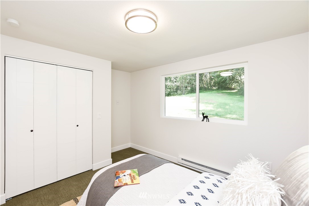 19409 High Rock Road Monroe, WA 98272 - Photo 29 of 40 a bedroom with a bed and a window