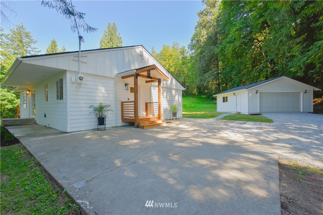19409 High Rock Road Monroe, WA 98272 - Photo 4 of 40 a view of a house with a yard and garage