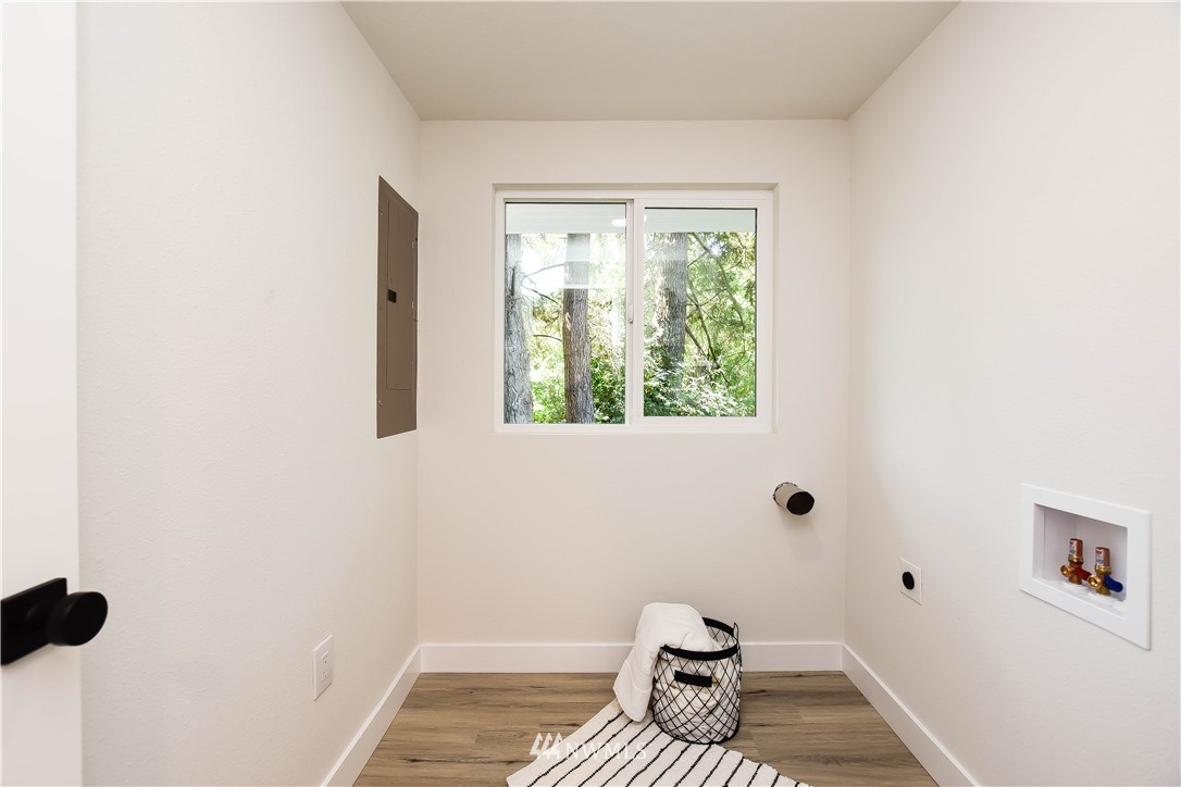 19409 High Rock Road Monroe, WA 98272 - Photo 32 of 40 a bathroom with a window and a toilet