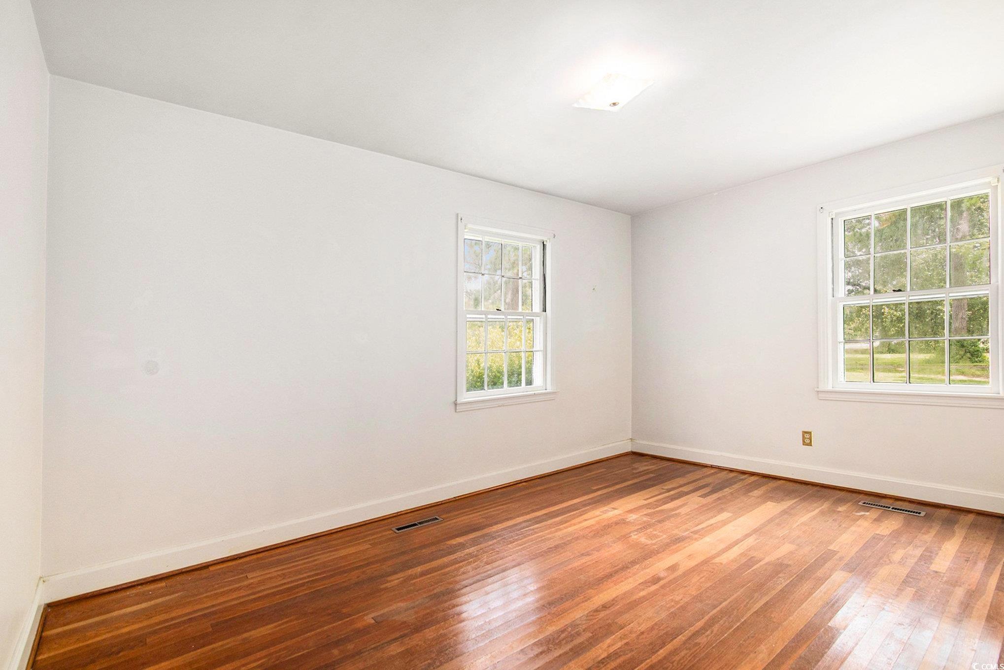 1008 North Main Street Marion, SC 29571 - Photo 12 of 27 Unfurnished room with hardwood / wood-style floors