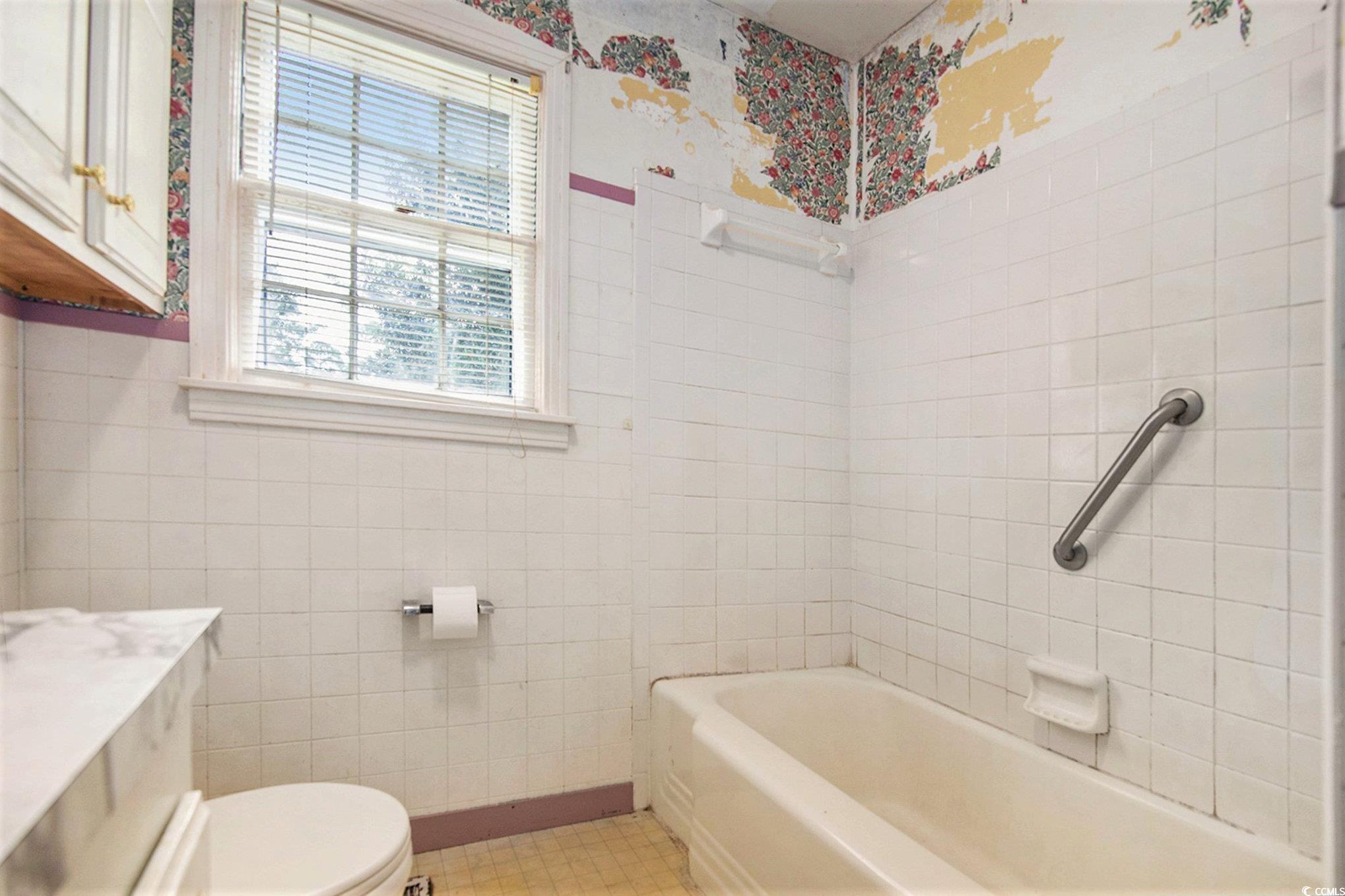 1008 North Main Street Marion, SC 29571 - Photo 18 of 27 Full bath featuring vanity, tile walls, and bathtub / shower combination