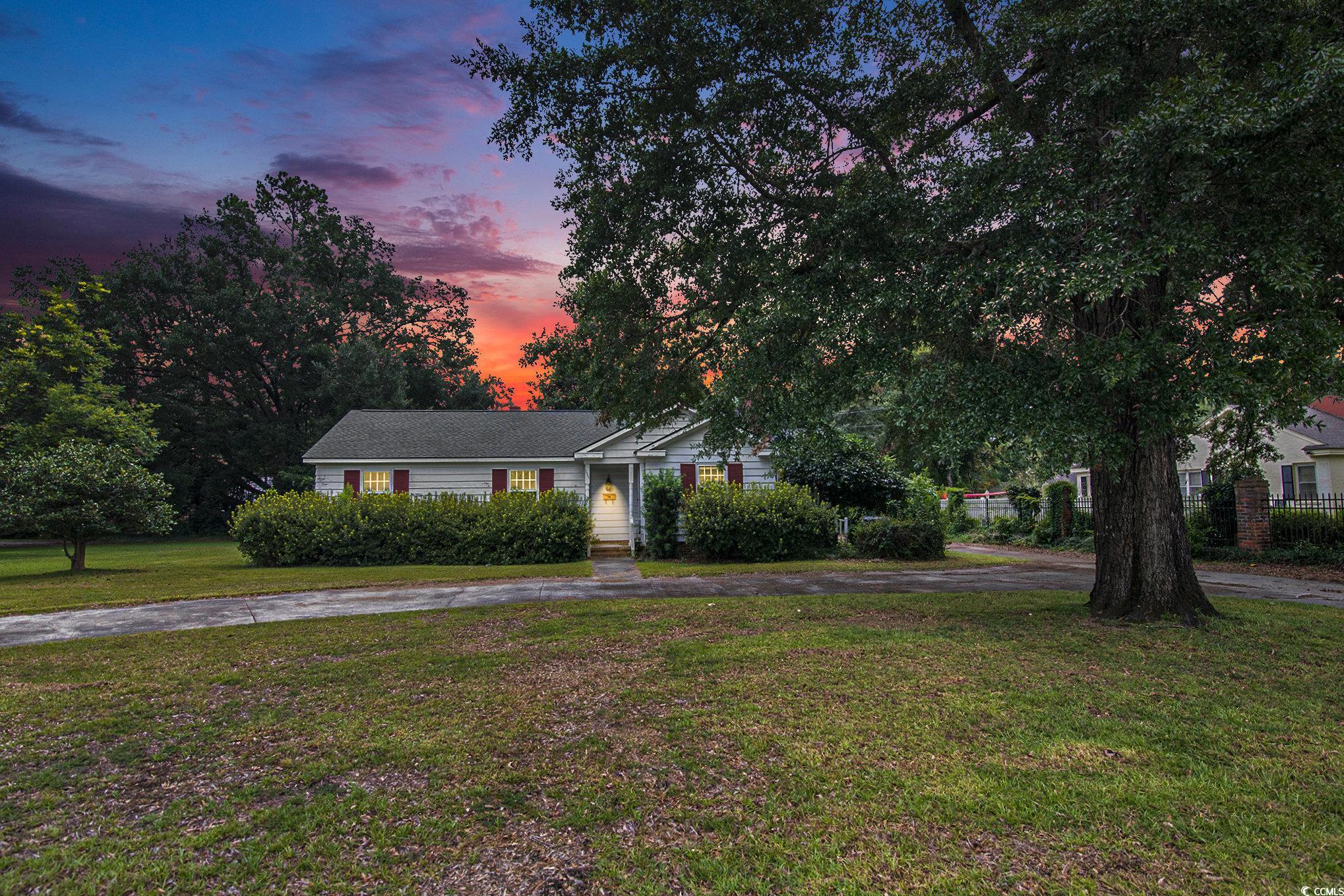 1008 North Main Street Marion, SC 29571 - Photo 2 of 27 View of front of house featuring a yard and asphalt driveway