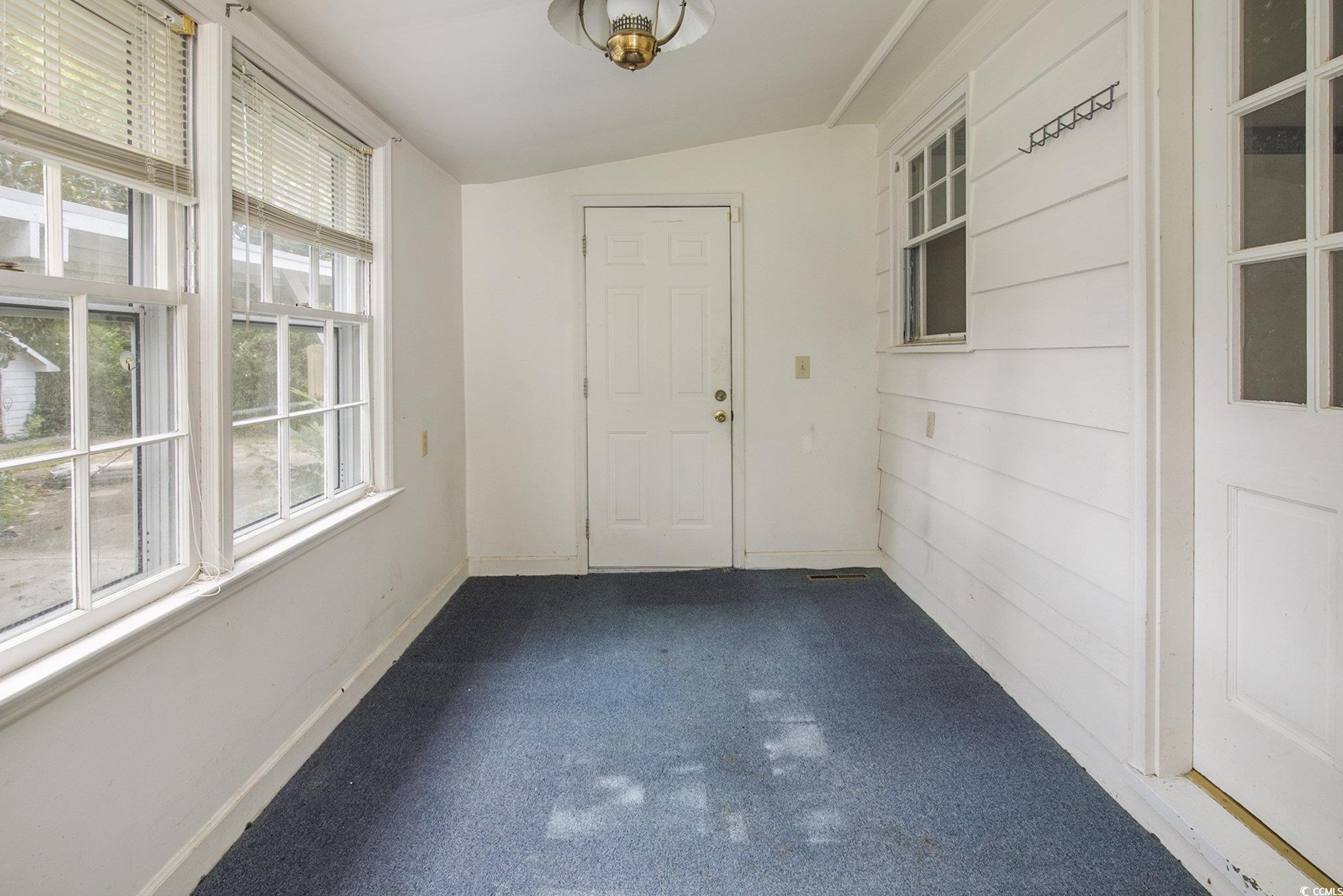 1008 North Main Street Marion, SC 29571 - Photo 23 of 27 Unfurnished sunroom featuring lofted ceiling