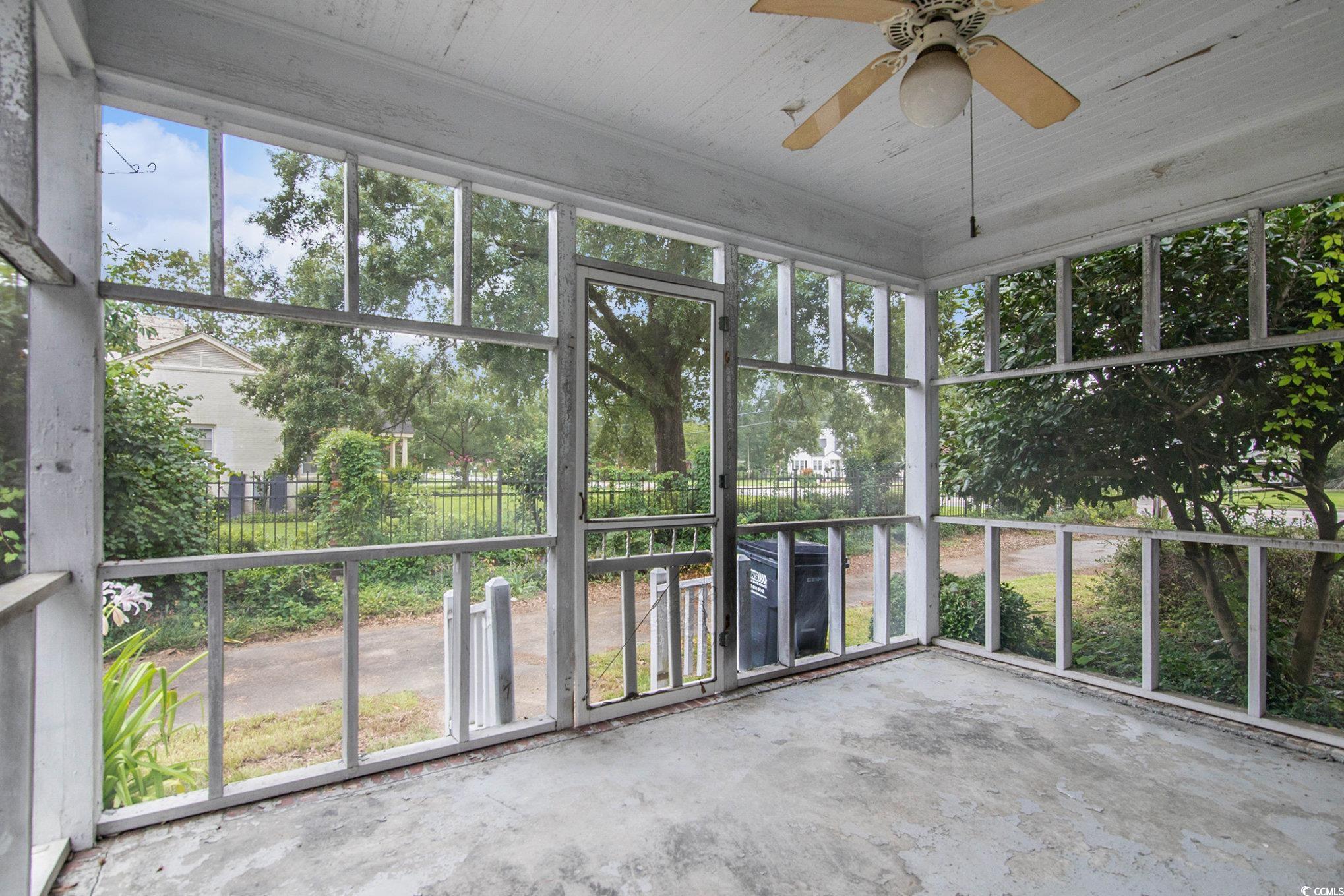 1008 North Main Street Marion, SC 29571 - Photo 26 of 27 Unfurnished sunroom featuring ceiling fan