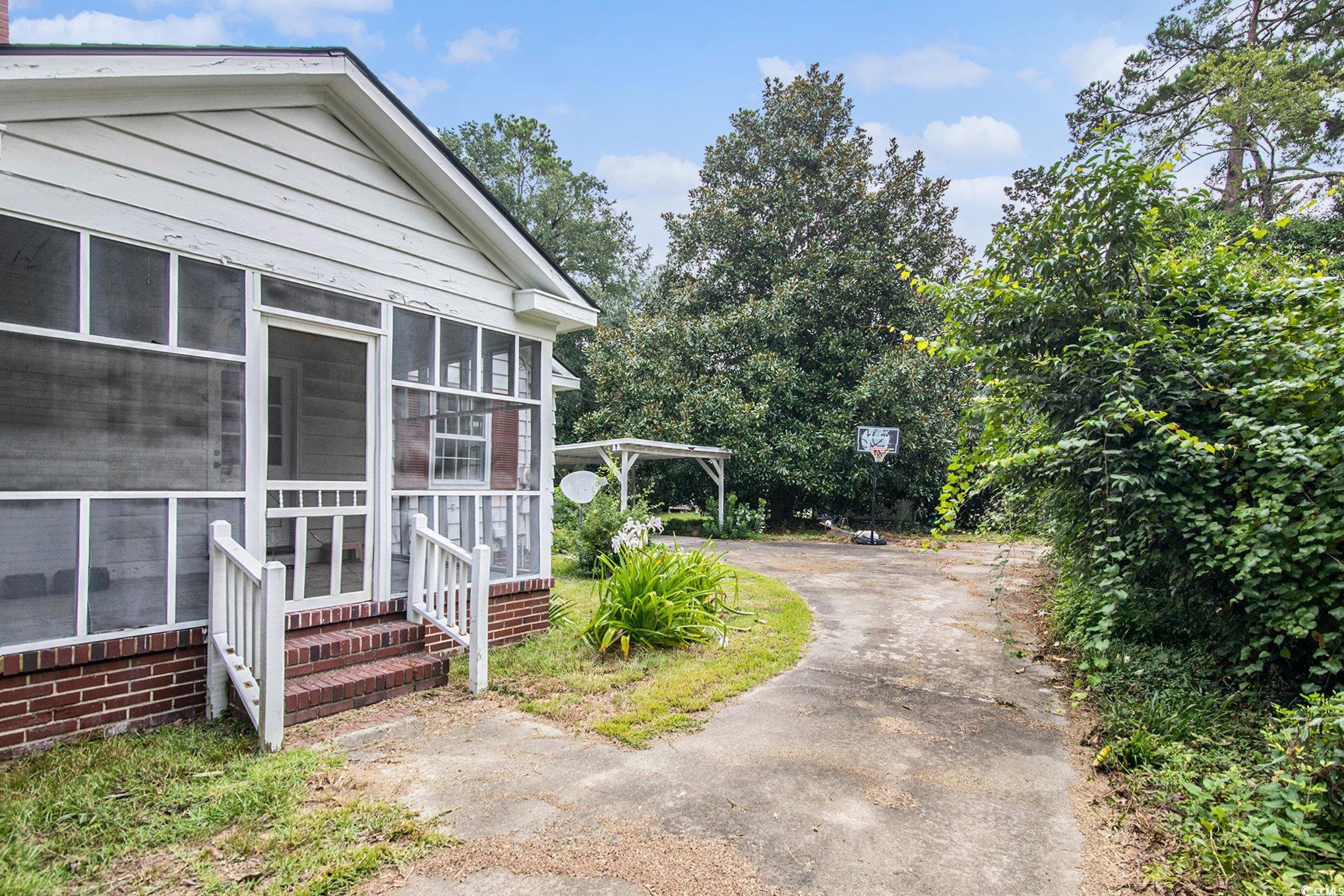1008 North Main Street Marion, SC 29571 - Photo 4 of 27 View of side of home with a sunroom