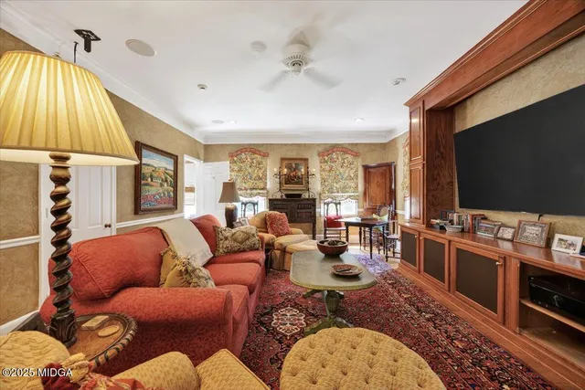 a view of a patio with a table and chairs under an umbrella