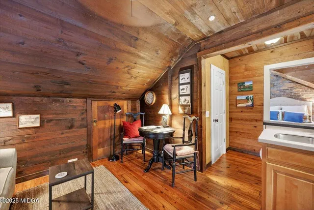 a bathroom with a toilet sink and shower