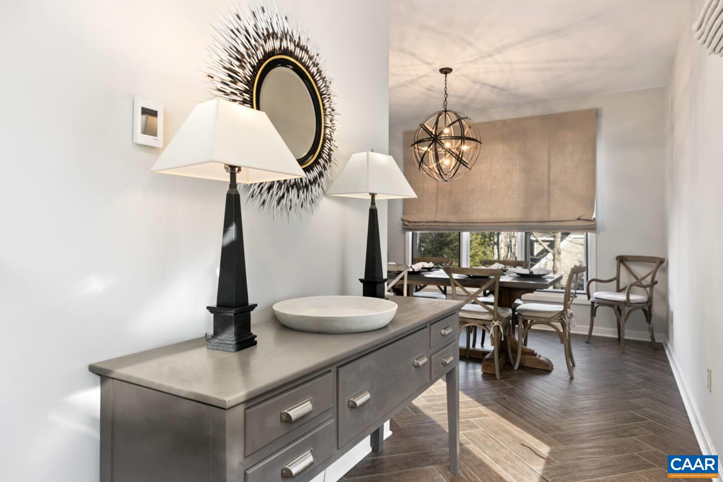 23 Trillium Cl Roseland, VA 22967 - Photo 11 of 48 a view of a dining room with furniture wooden floor and chandelier