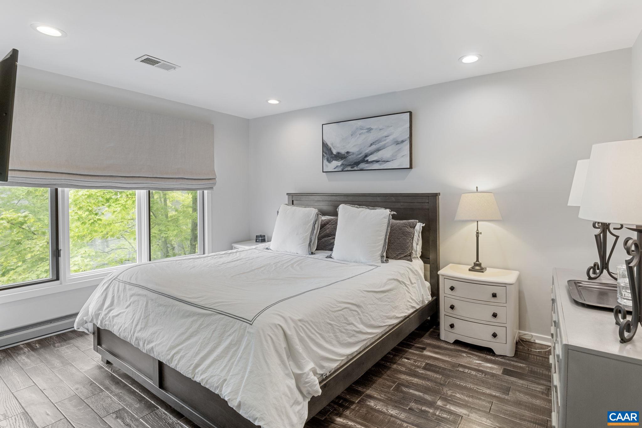 23 Trillium Cl Roseland, VA 22967 - Photo 23 of 48 a bedroom with a bed and a large window