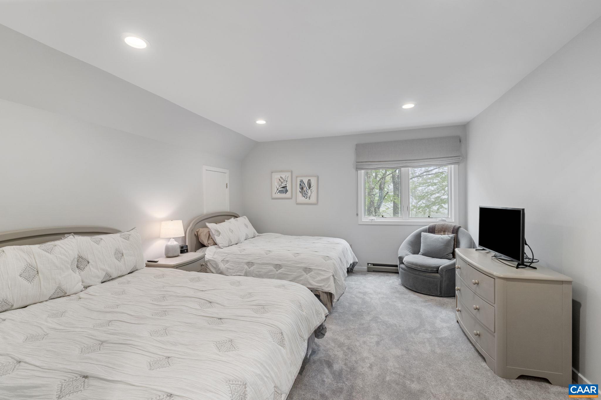 23 Trillium Cl Roseland, VA 22967 - Photo 28 of 48 a bedroom with bed tv and window