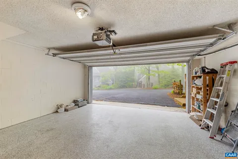 a view of a livingroom with hardwood floor and a ceiling fan