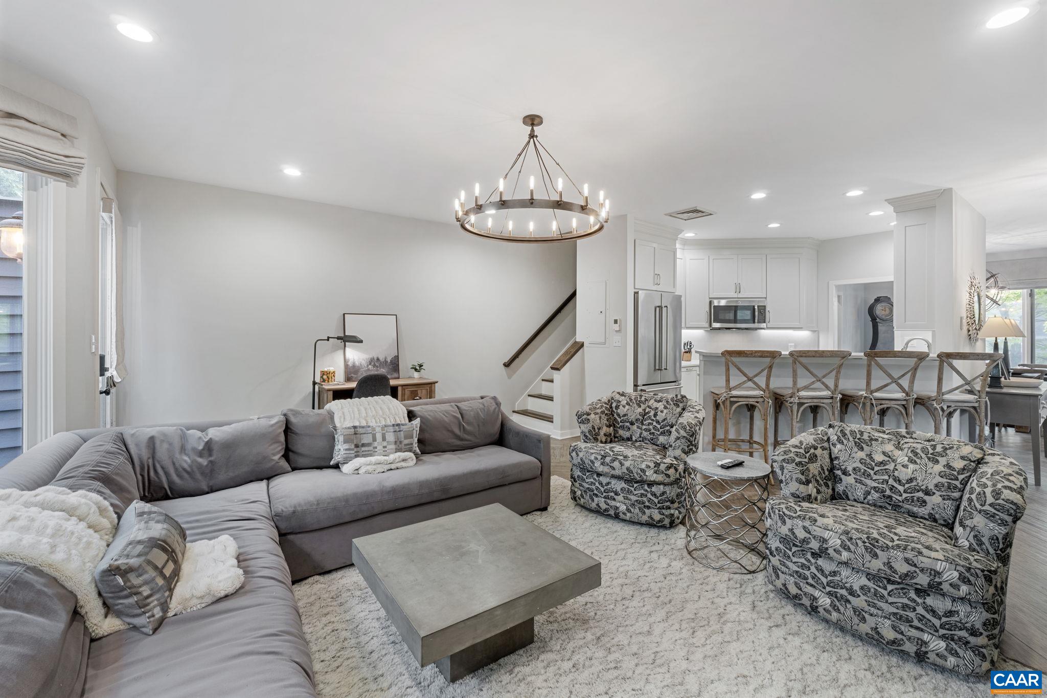 23 Trillium Cl Roseland, VA 22967 - Photo 4 of 48 a living room with furniture and a chandelier