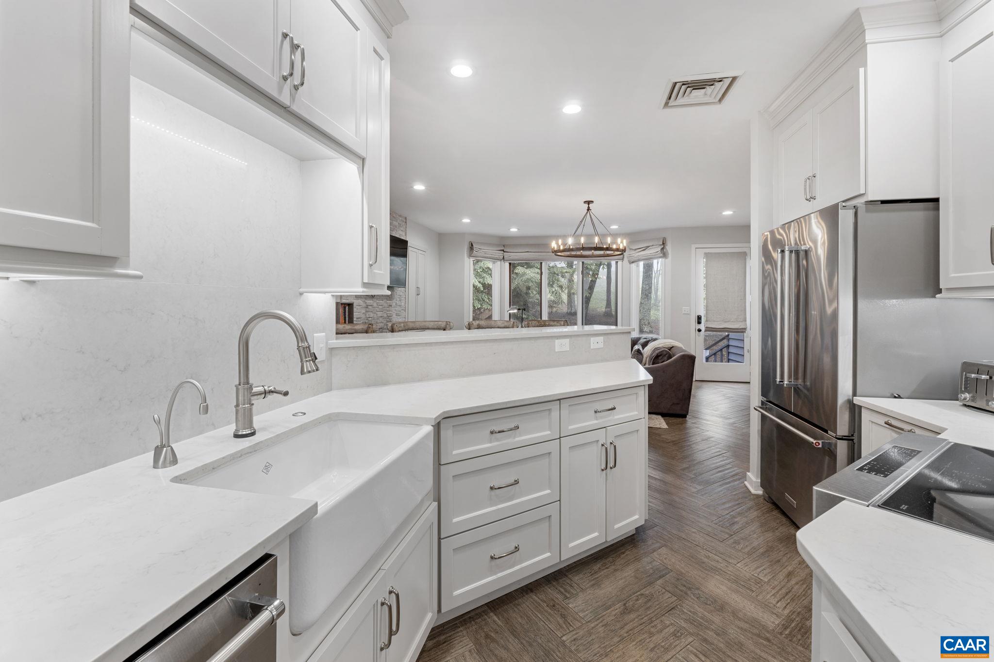 23 Trillium Cl Roseland, VA 22967 - Photo 6 of 48 a kitchen with a sink stainless steel appliances and cabinets
