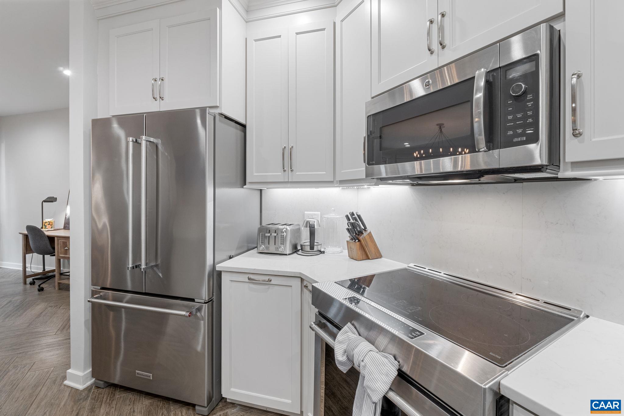 23 Trillium Cl Roseland, VA 22967 - Photo 7 of 48 a kitchen with a refrigerator sink and cabinets