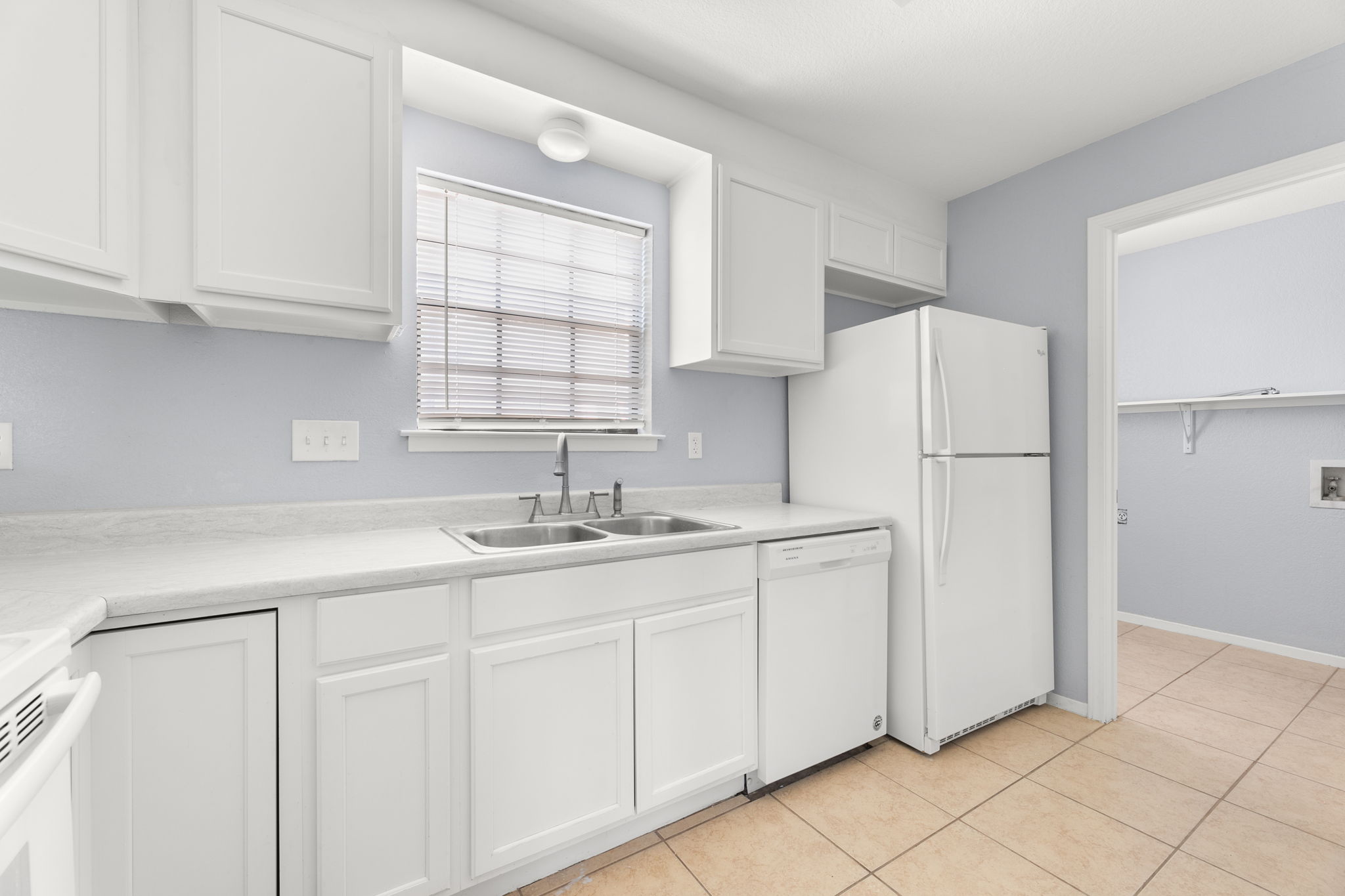 3802 Foust Trail, Unit A Georgetown, TX 78628 - Photo 11 of 34 Modern kitchen with crisp white cabinetry and essential appliances.