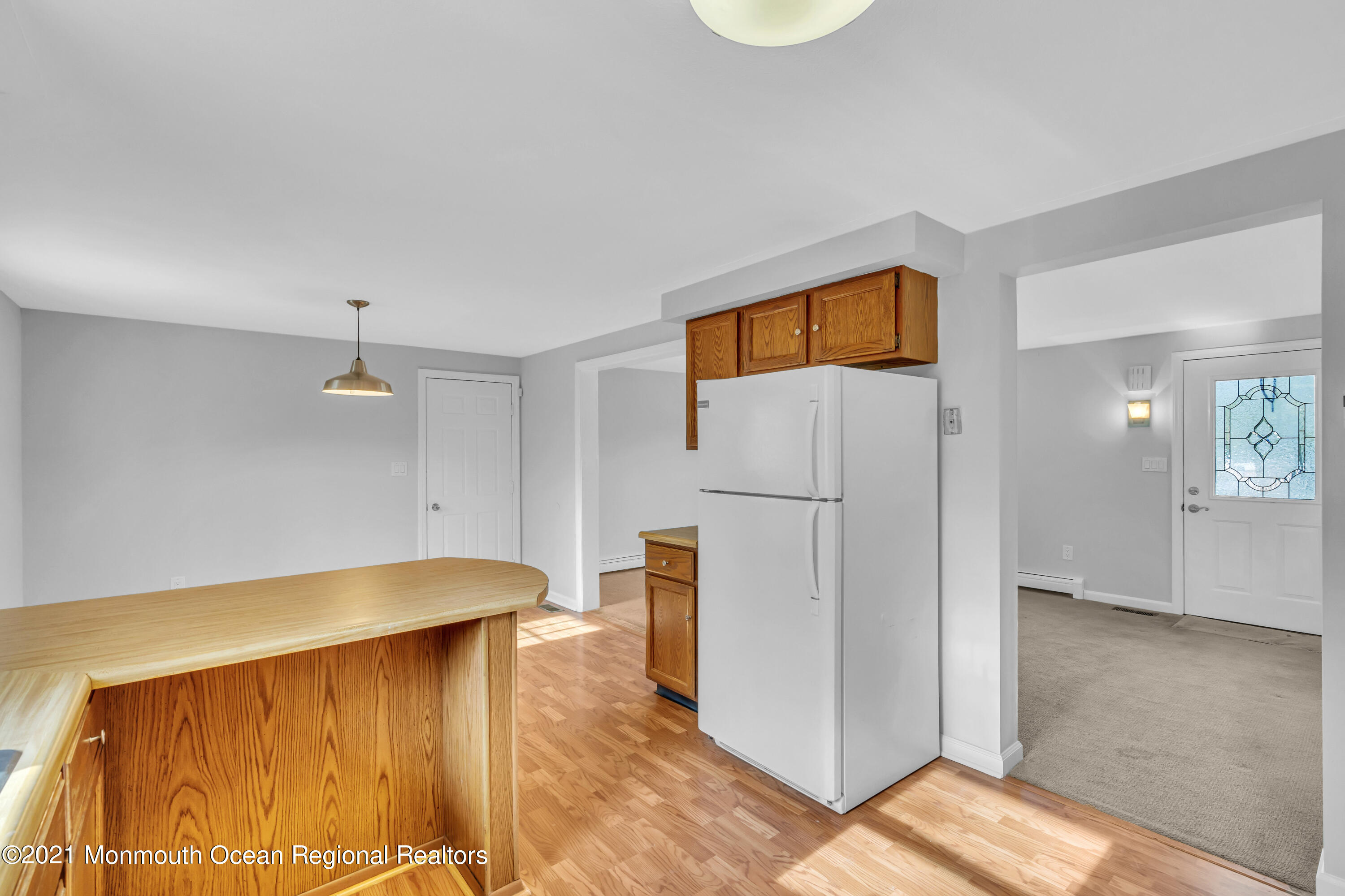 11 Tennent Road Morganville, NJ 07751 - Photo 13 of 20 a view of kitchen with furniture and refrigerator