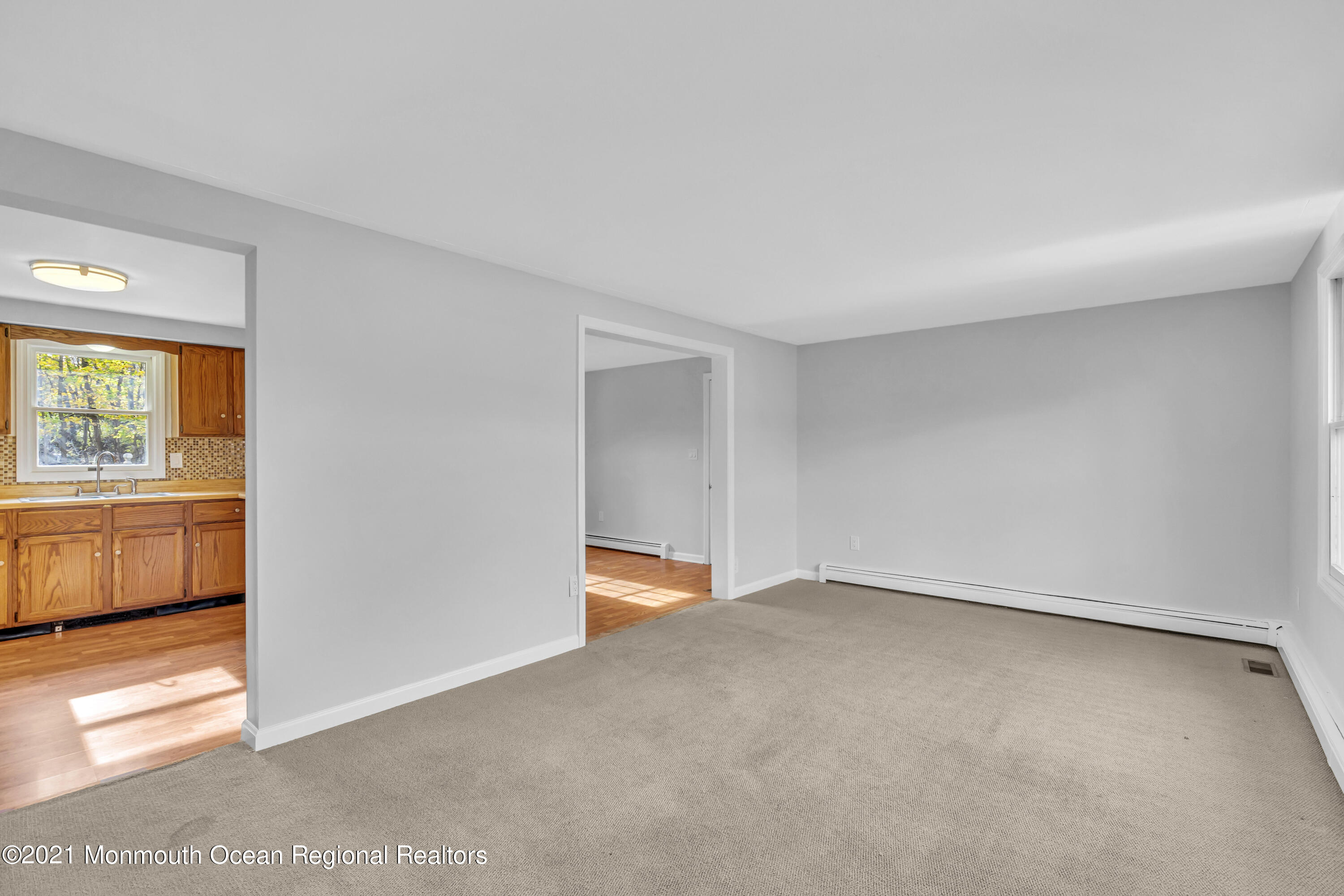 11 Tennent Road Morganville, NJ 07751 - Photo 4 of 20 a view of an empty room with a window