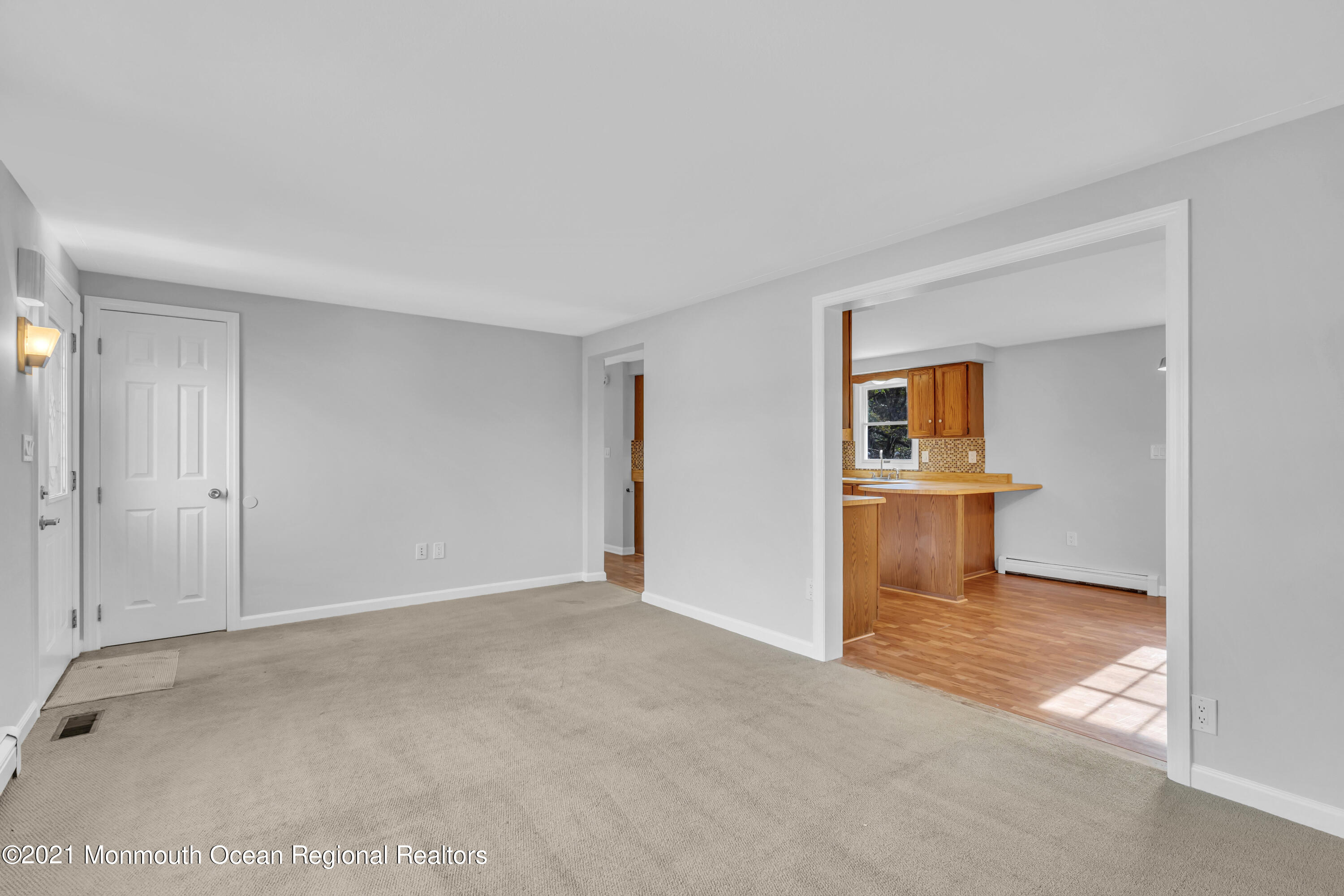 11 Tennent Road Morganville, NJ 07751 - Photo 5 of 20 a view of a kitchen and a sink cabinet and a living room