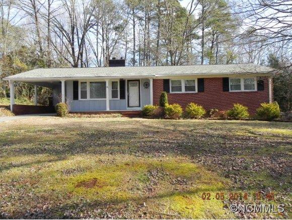 331 Edwards Street Rutherfordton, NC 28139 - Photo 1 of 20 a front view of a house with a garden