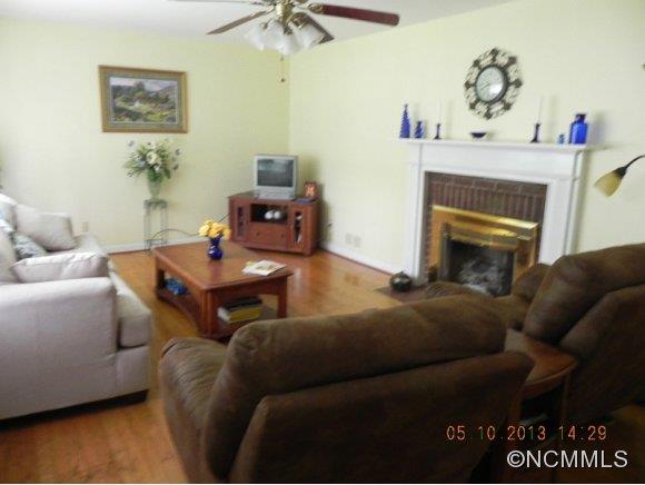 331 Edwards Street Rutherfordton, NC 28139 - Photo 3 of 20 a living room with furniture and a fireplace