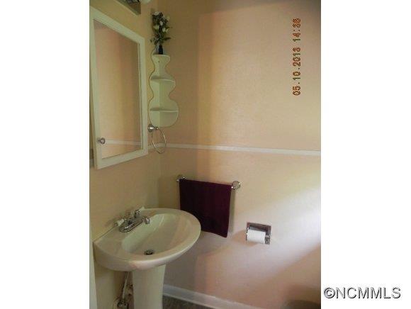 331 Edwards Street Rutherfordton, NC 28139 - Photo 9 of 20 a bathroom with a sink and a mirror