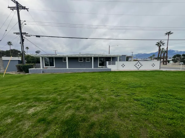 a view of a large building next to a big yard