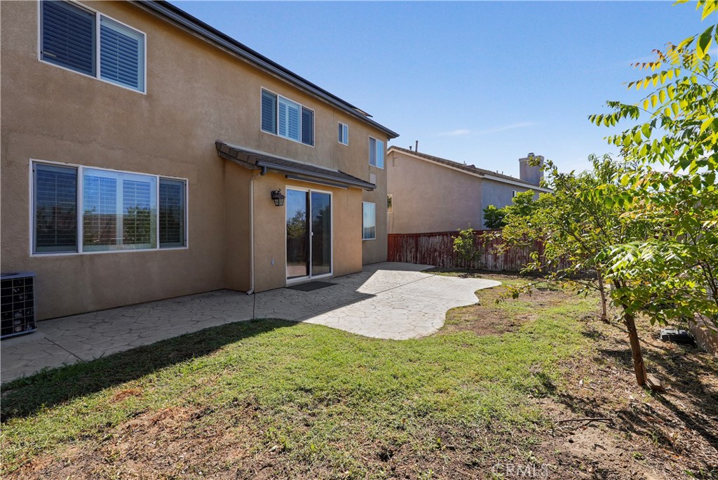 38815 Cobblestone Circle Murrieta, CA 92563 - Photo 21 of 49 a view of a house with a yard and potted plants