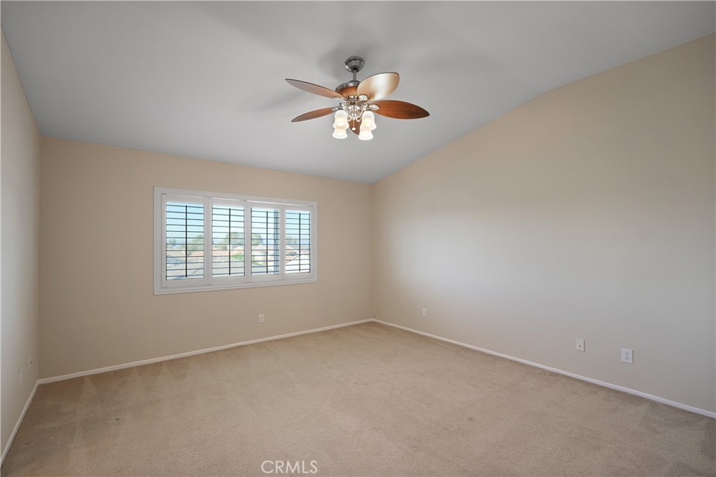 38815 Cobblestone Circle Murrieta, CA 92563 - Photo 24 of 49 an empty room with a window and a fan
