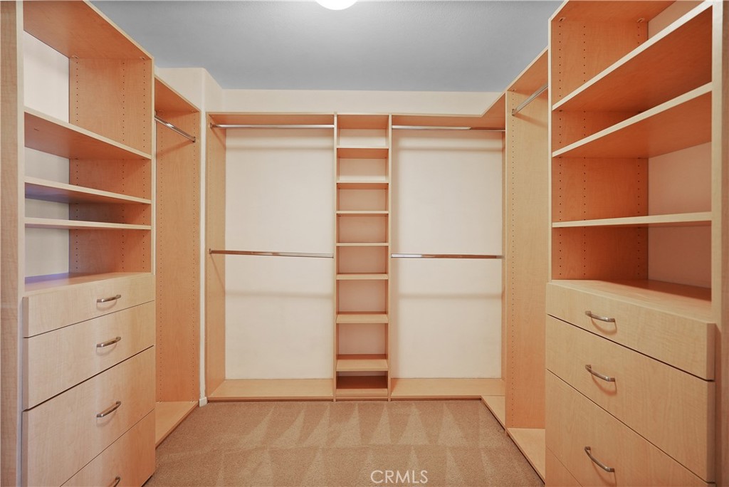38815 Cobblestone Circle Murrieta, CA 92563 - Photo 32 of 49 a view of walk in closet with empty racks