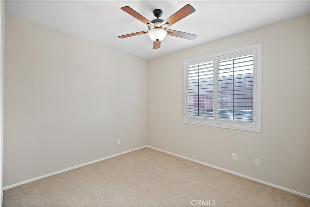 38815 Cobblestone Circle Murrieta, CA 92563 - Photo 33 of 49 an empty room with a window and a fan