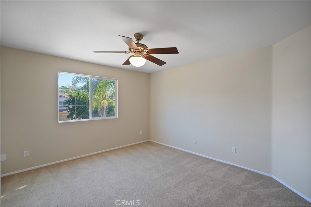 38815 Cobblestone Circle Murrieta, CA 92563 - Photo 35 of 49 an empty room with a window and a fan