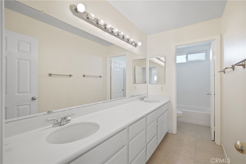 38815 Cobblestone Circle Murrieta, CA 92563 - Photo 41 of 49 a spacious bathroom with a double vanity sink mirror and double