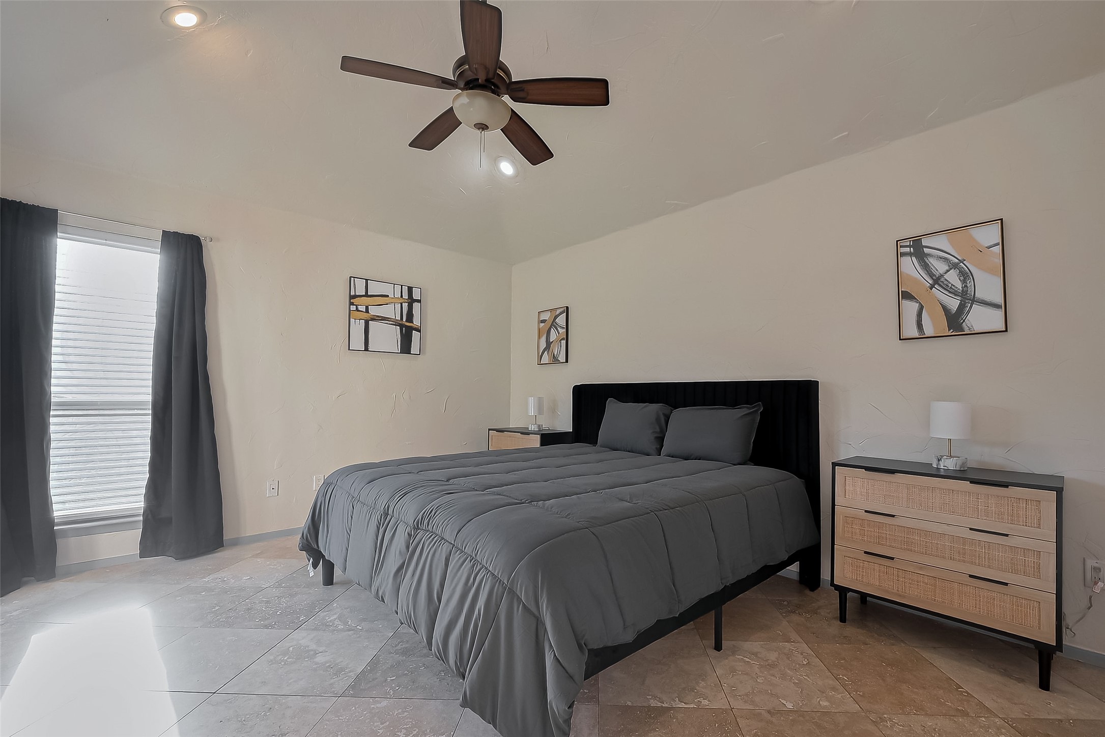 30411 Arborg Drive Spring, TX 77386 - Photo 14 of 30 a bedroom with a bed and a chandelier