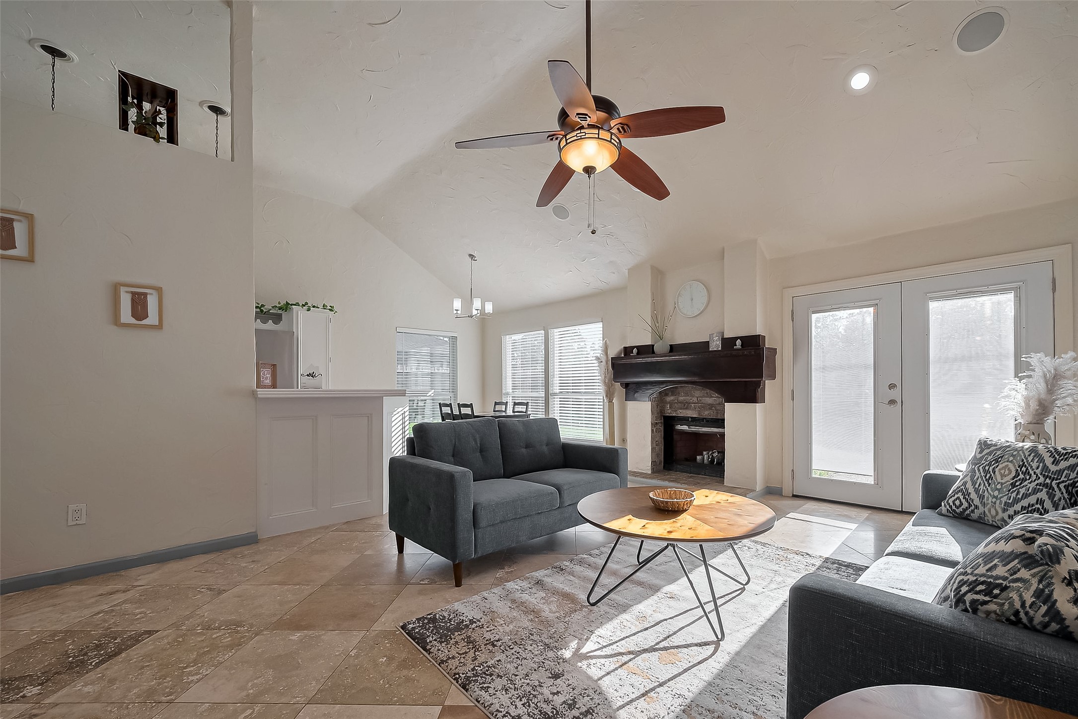30411 Arborg Drive Spring, TX 77386 - Photo 2 of 30 a living room with furniture a rug and a chandelier