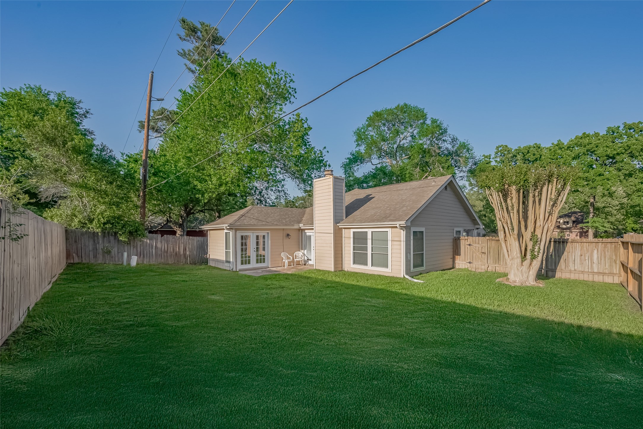30411 Arborg Drive Spring, TX 77386 - Photo 26 of 30 a front view of a house with a yard and trees