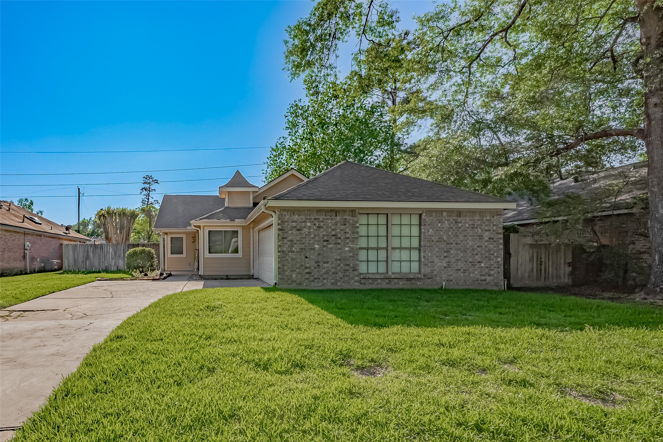 30411 Arborg Drive Spring, TX 77386 - Photo 29 of 30 a view of a yard in front of a house with a large tree
