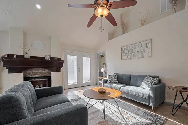 a living room with furniture and a fireplace